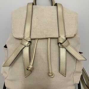 Fun summer back pack!  Light colored canvas with gold thread. Pockets inside too
